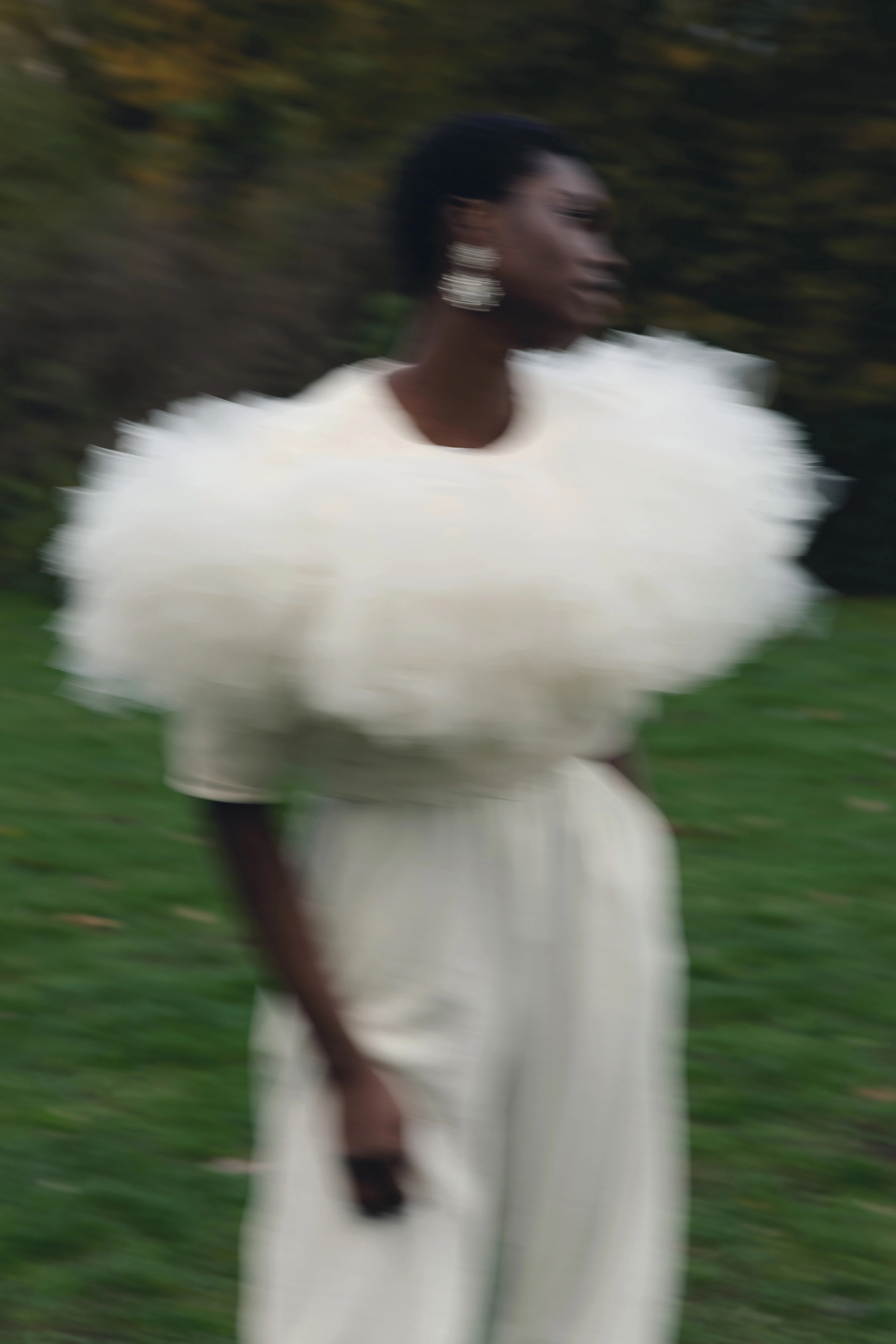 Outdoor fashion editorial: model jumping in a white tulle dress, a blue tulle collar portrait and a white fluffy top