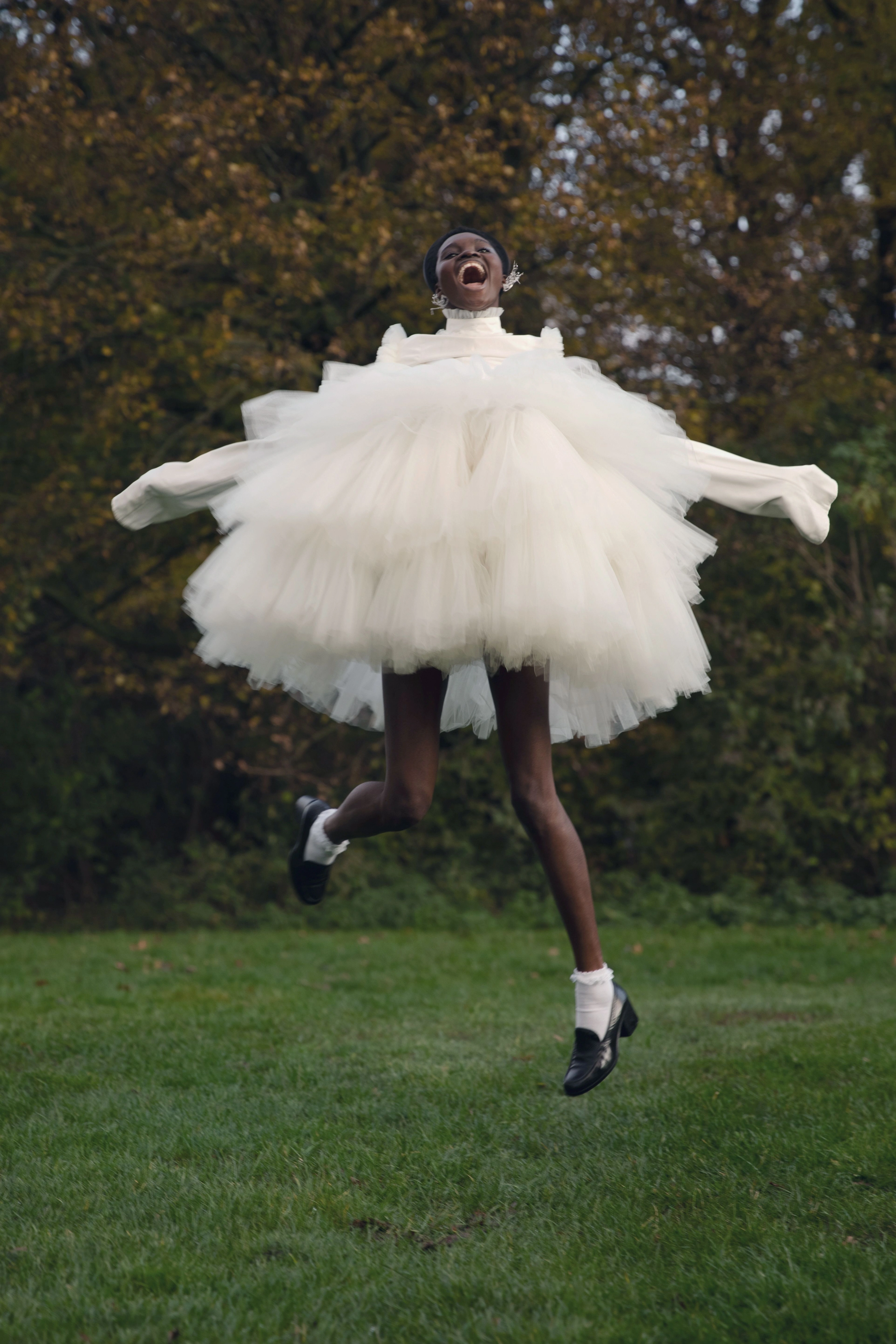 Outdoor fashion editorial: model jumping in a white tulle dress, a blue tulle collar portrait and a white fluffy top