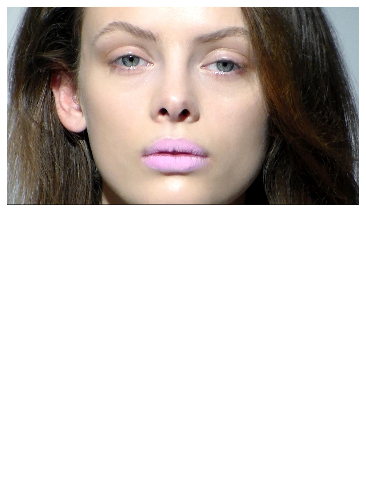 Beauty close-up of a model with lilac lips, eyes open and closed
